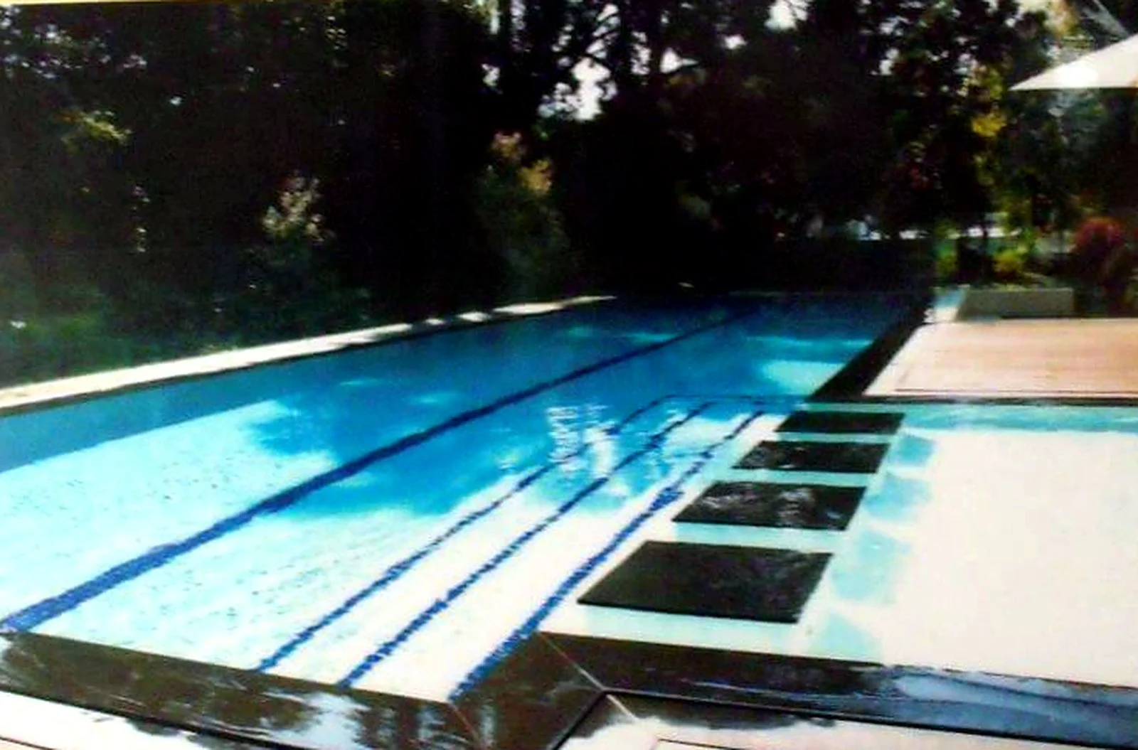 Covered lap pool with timber deck