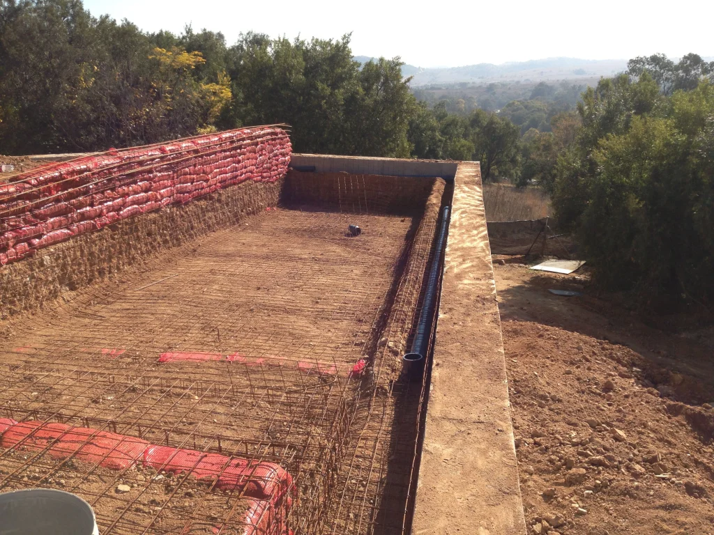 Raised infinity pool over the veld — before the work