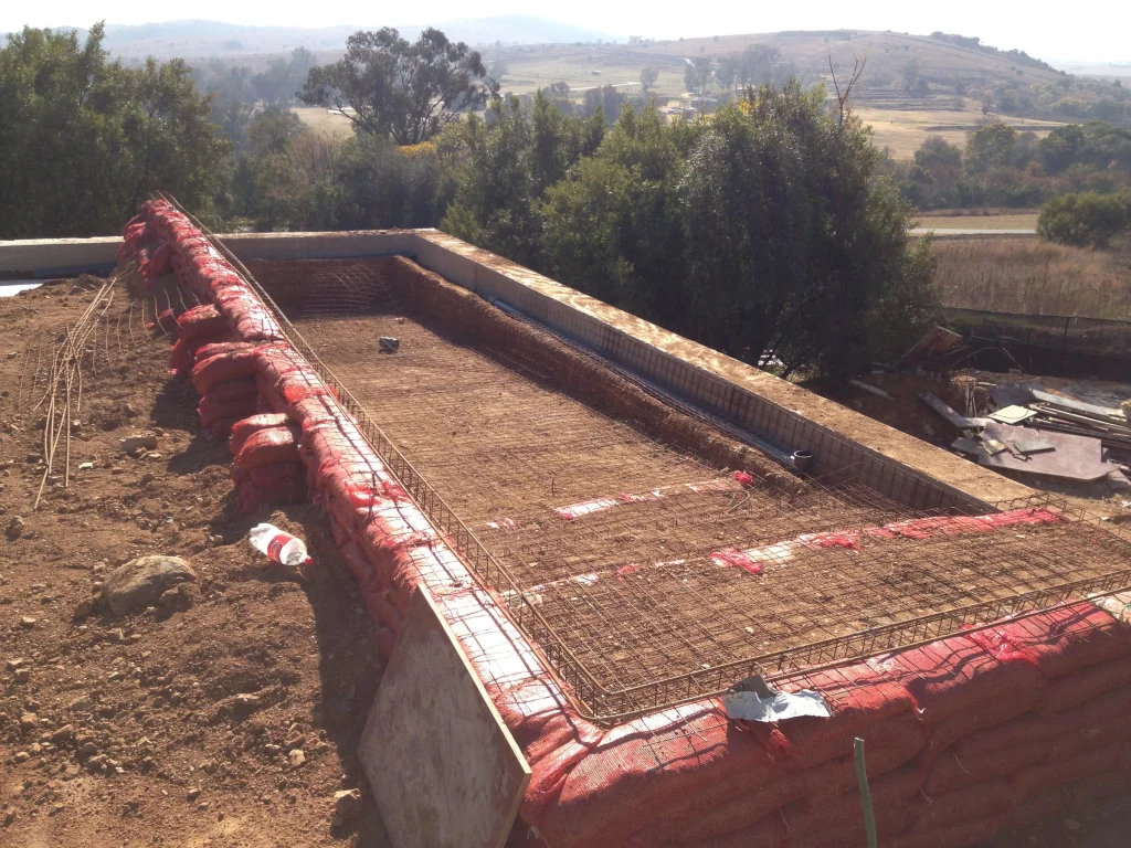 Raised infinity pool over the veld — before the work