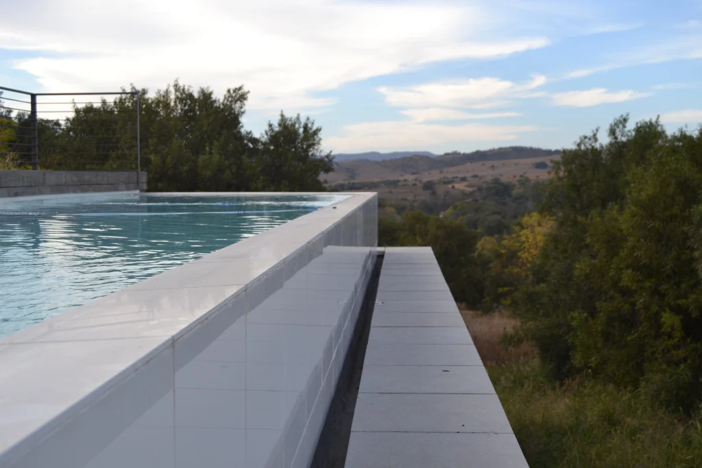 Raised infinity pool over the veld — completed
