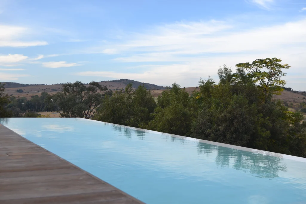 Raised infinity pool over the veld — completed
