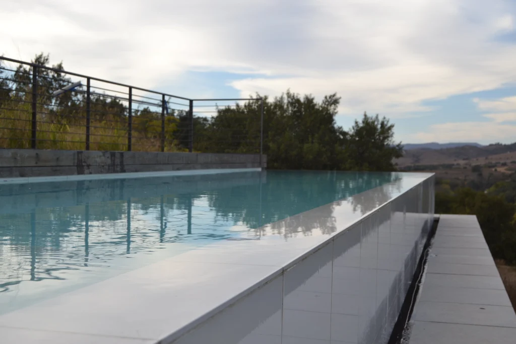 Raised infinity pool over the veld — completed